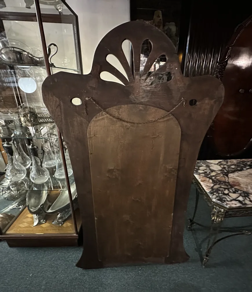 antique mirror with decorative frame in an elegant setting