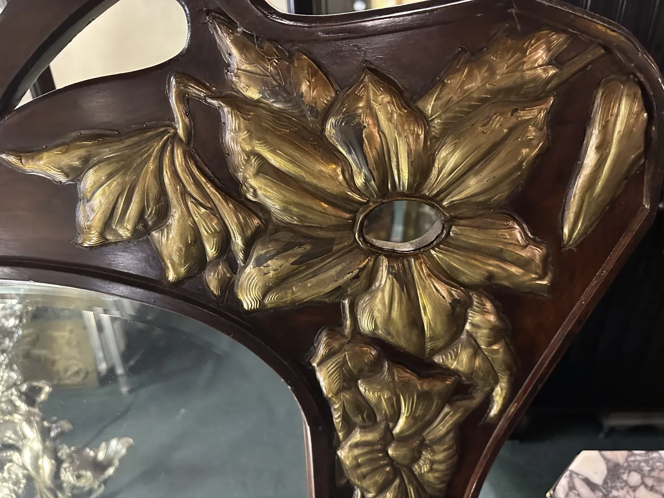 antique mirror with carved flowers and leaves