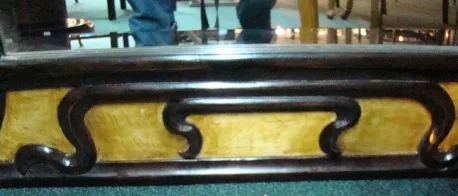 antique mirror with decorative frame and details at the bottom