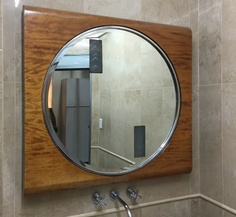 antique round mirror in a stylish bathroom