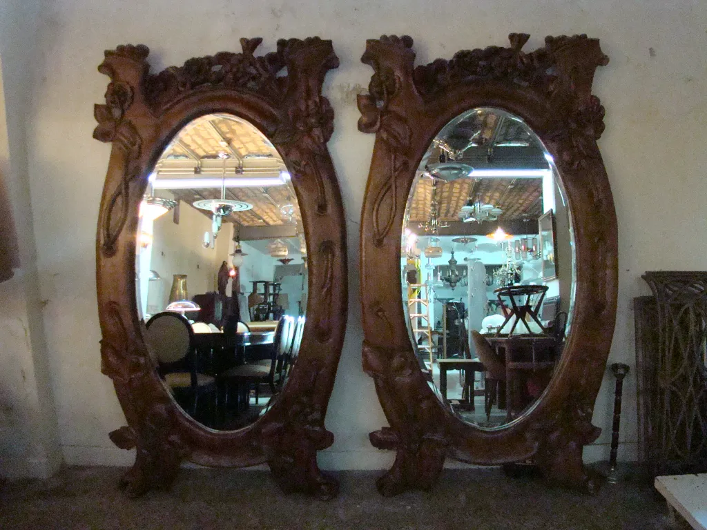 antique decorative mirrors with elaborately carved designs, gray background