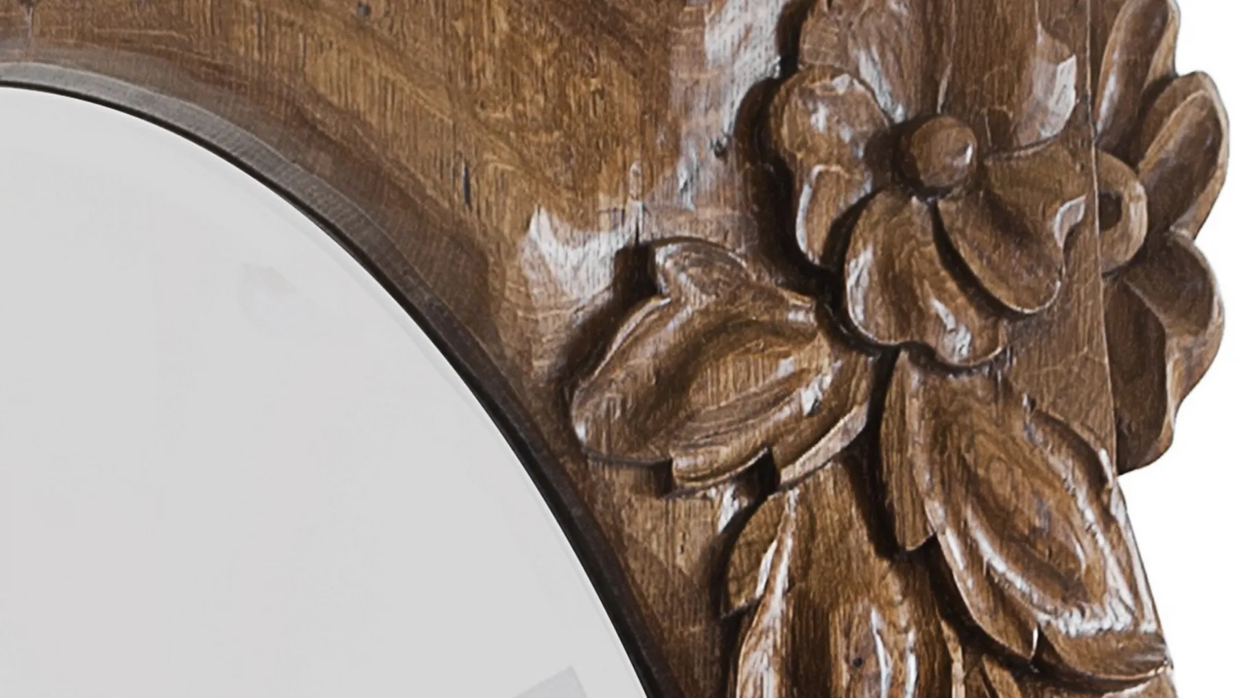 antique mirror with wooden frame and floral details