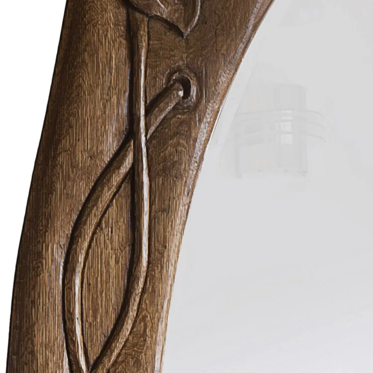 antique mirror decorated with floral carvings