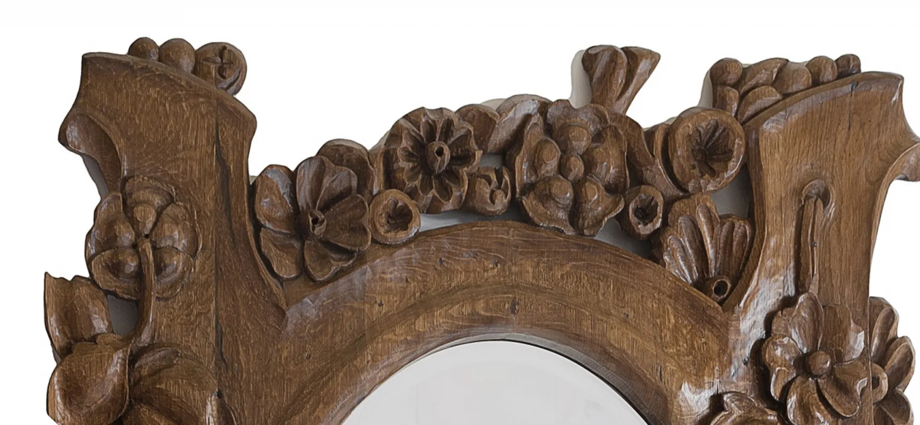 specchio antico con cornice in legno intagliata e fiori