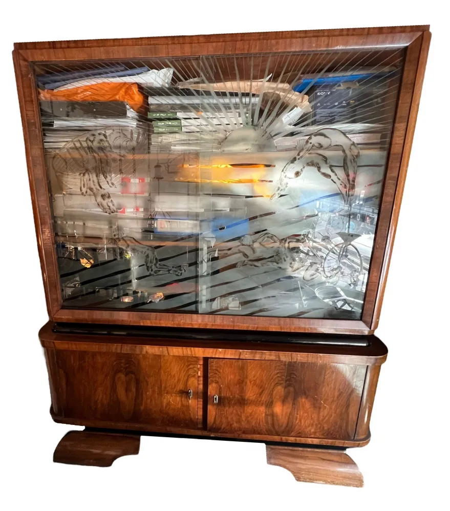 antique bookcase with shelves, doors, and decorations