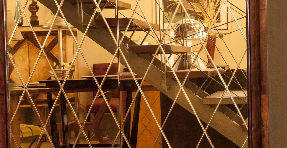 Antique bookcase in a contemporary decorated room with modern elements.