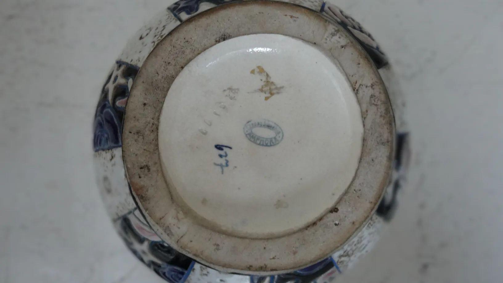 Base of antique decorative ceramic with blue details