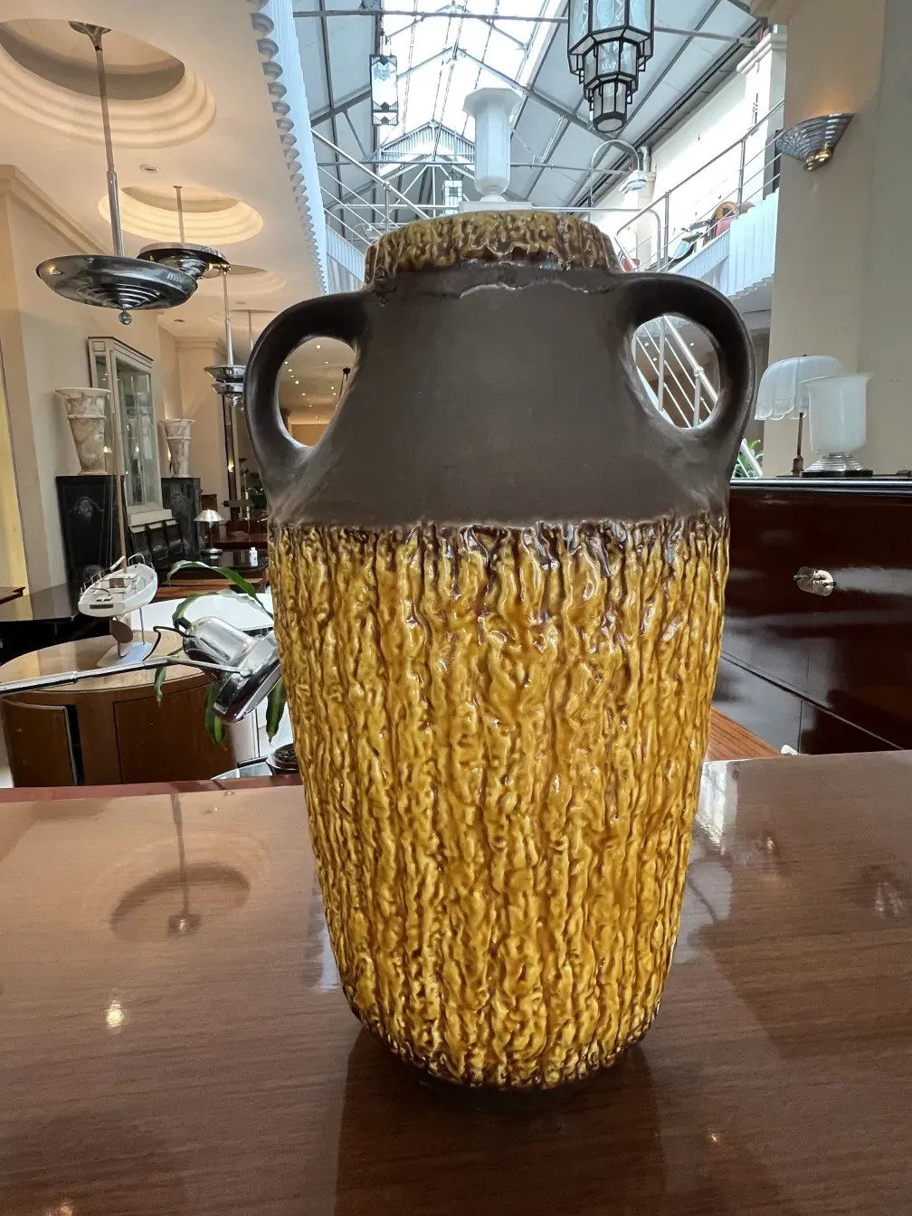 antique ceramic vase with yellow and brown texture