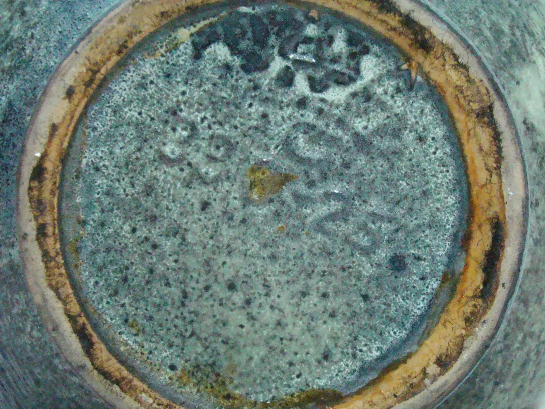 Top view of an antique decorative ceramic with details.