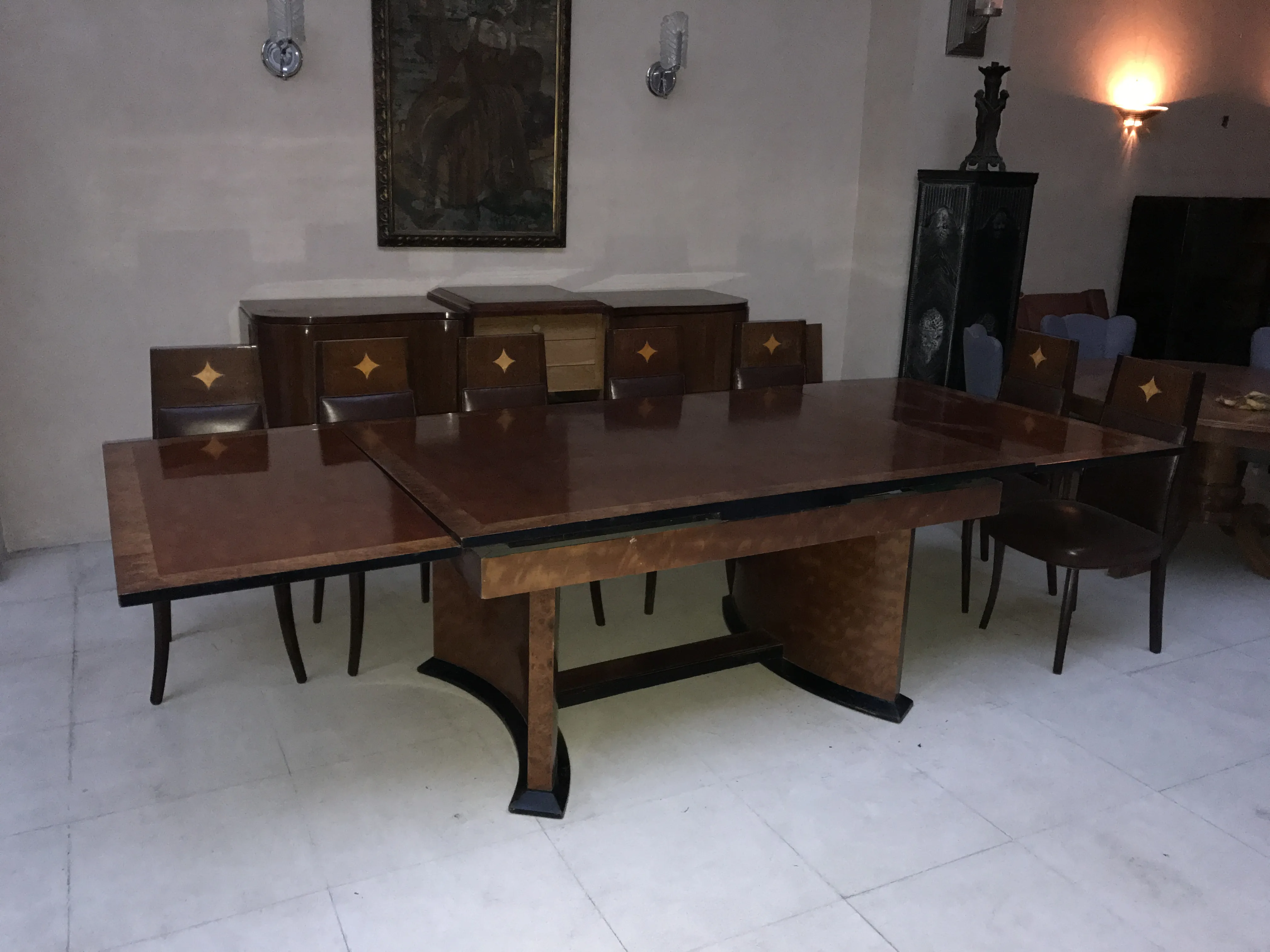 Antique Art Deco dining table for 12 people, in an elegant setting.