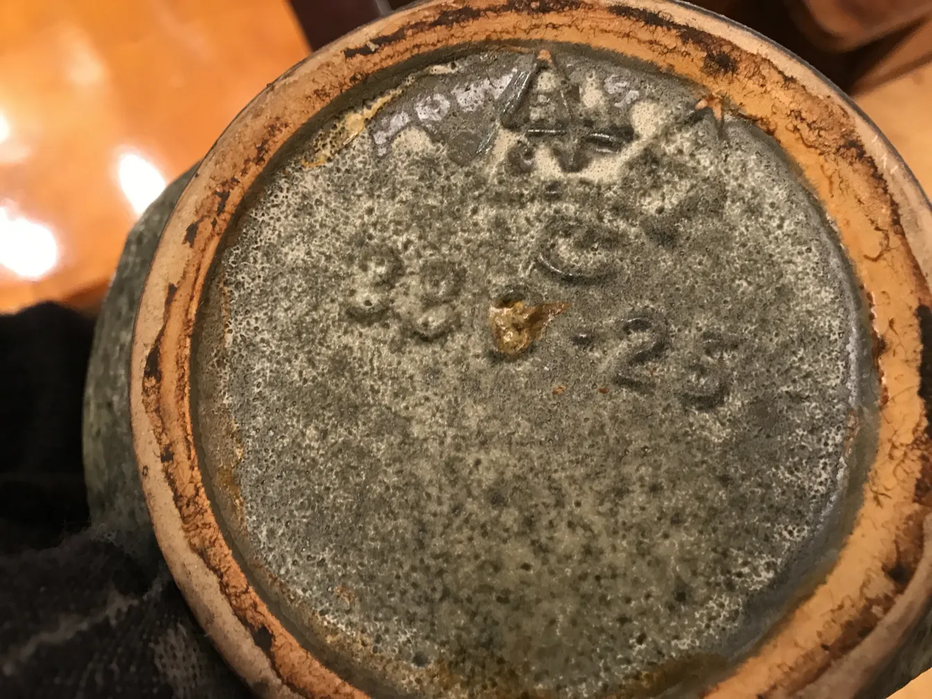 Bottom view of an antique ceramic with visible details