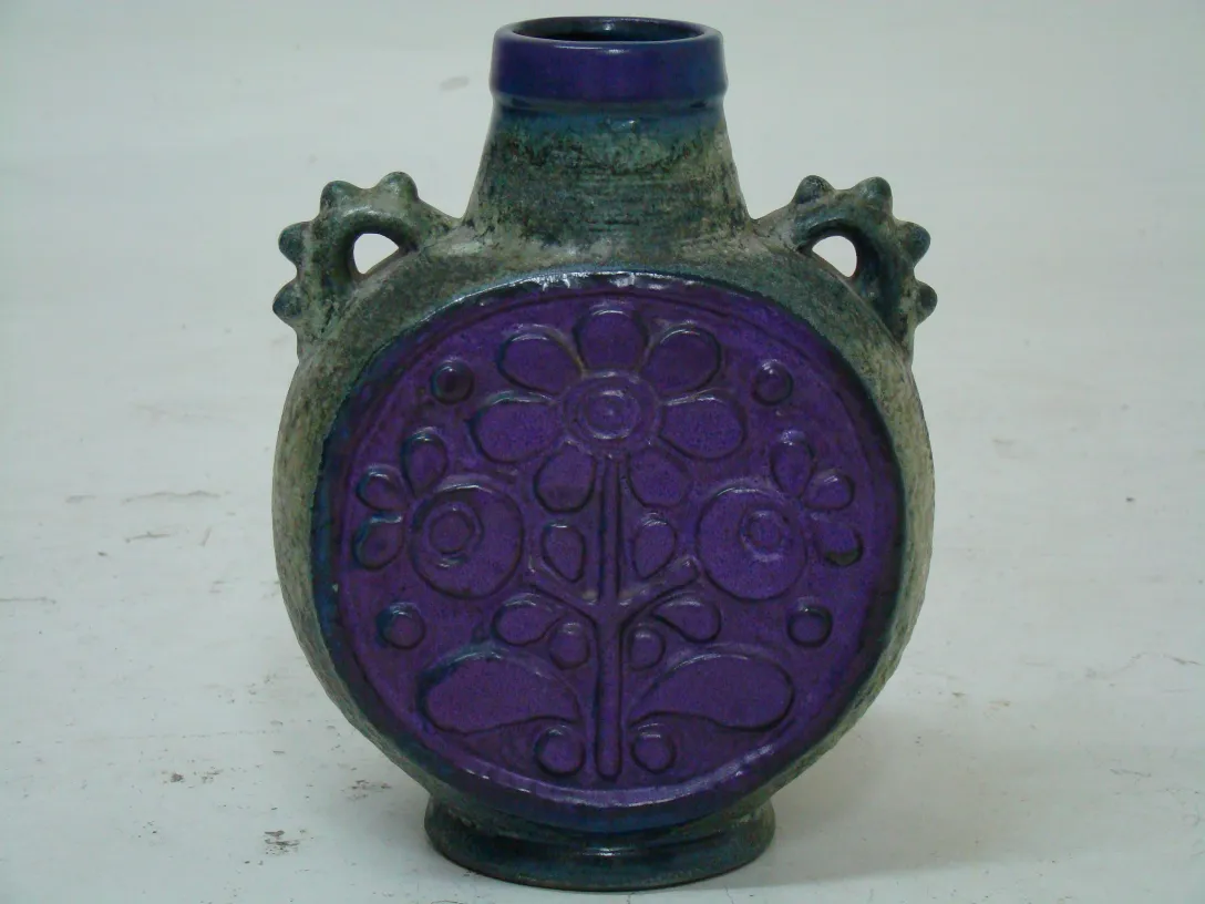 Antique ceramic with floral design and handles