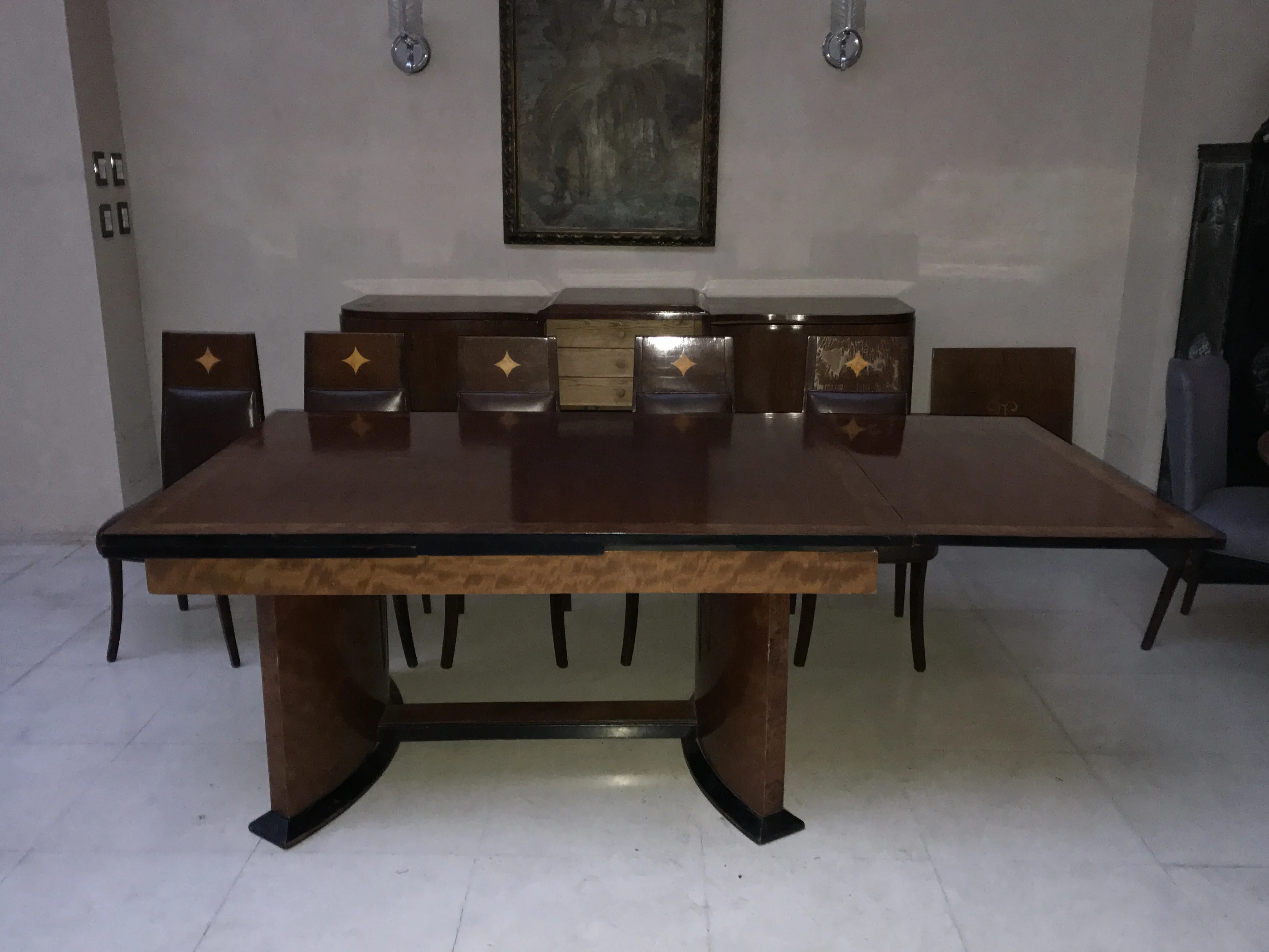 Antique Art Deco dining table for 12 people in an elegant setting.