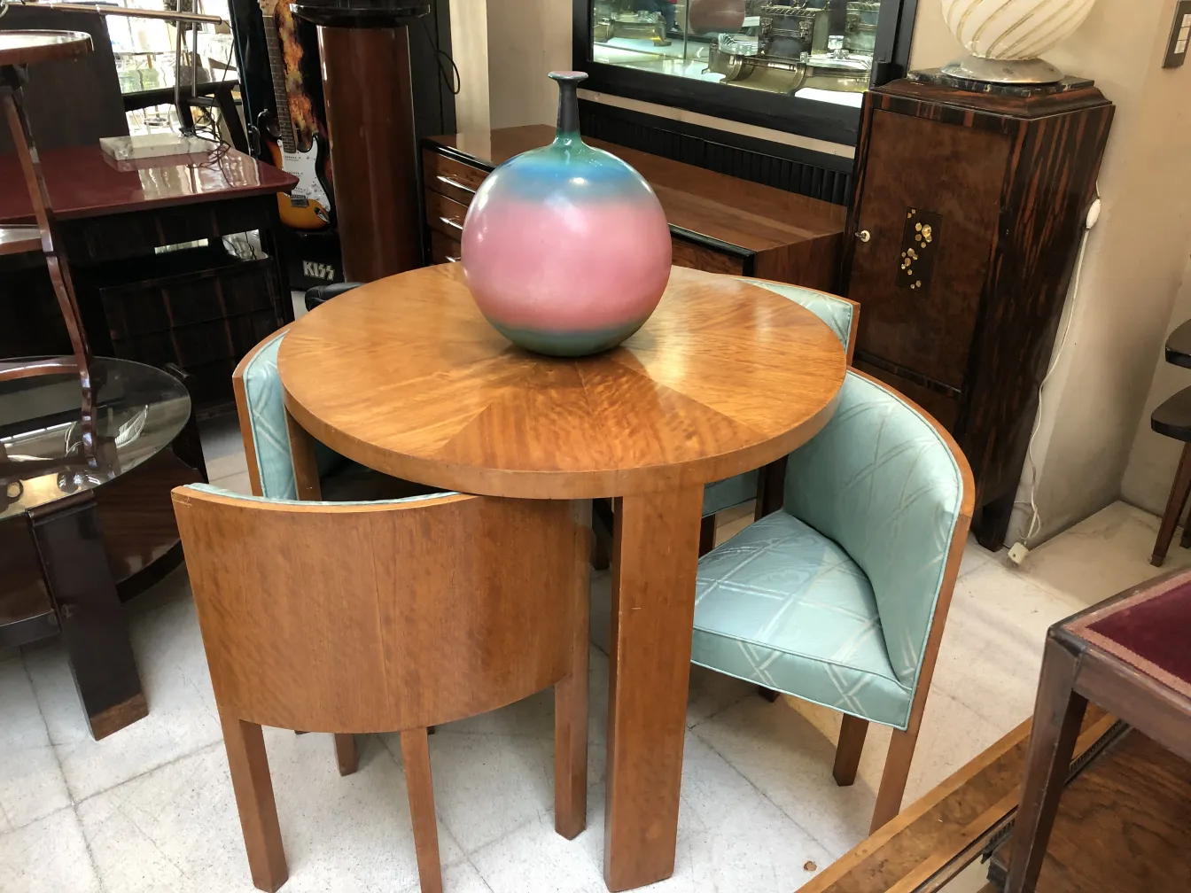 Antique decorative ceramic sphere in soft colors on a round table