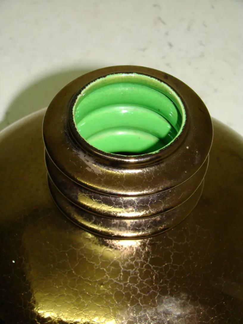 close-up of an antique ceramic with green details