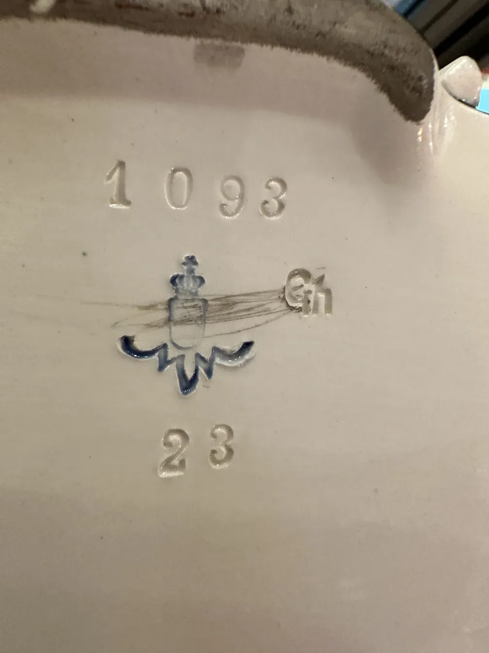 Antique ceramic from Karlsruher Majolika Manufaktur showing mark detail.