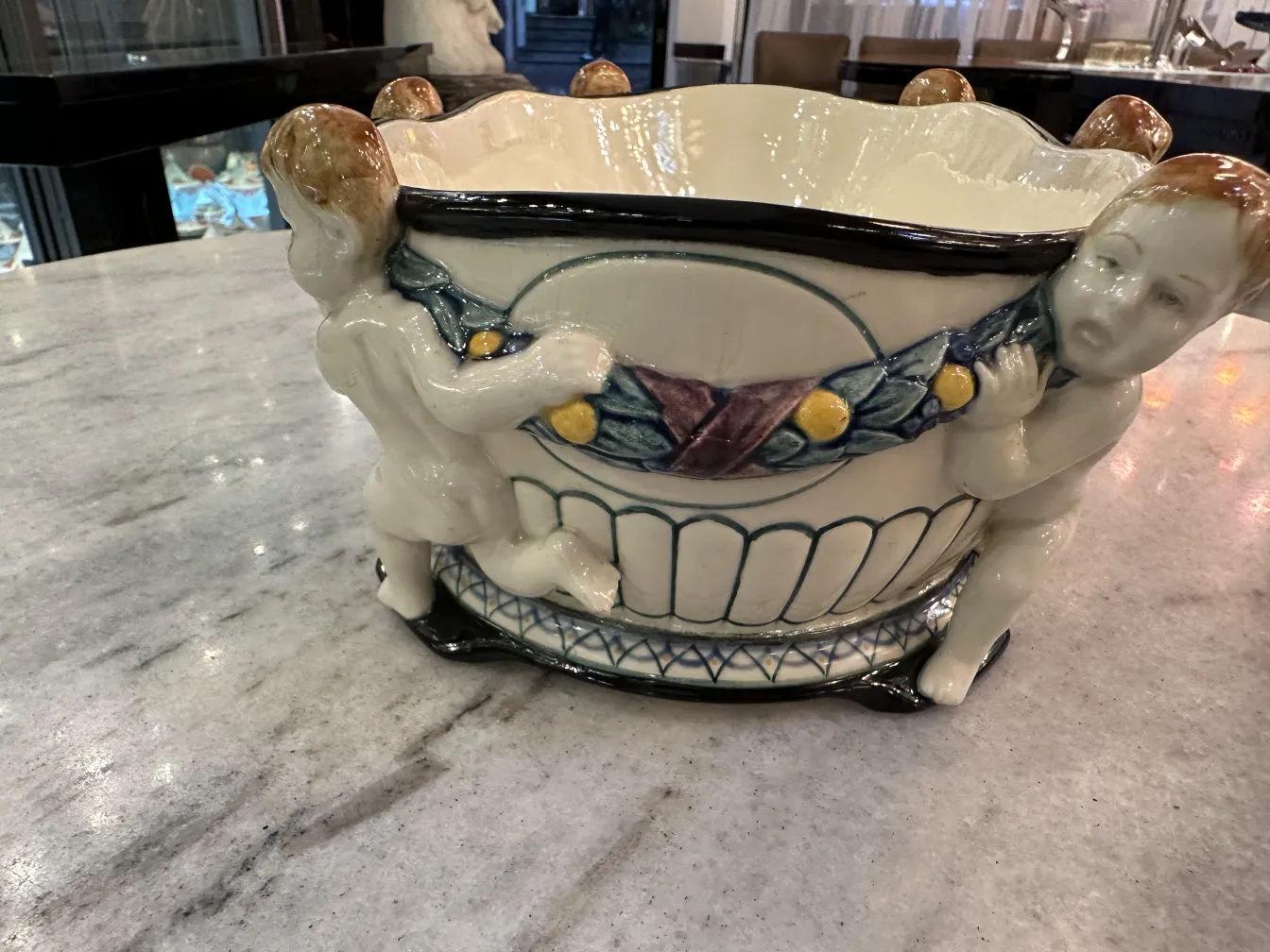 Antique ceramic from Karlsruher Majolika Manufaktur featuring ornamental figures.