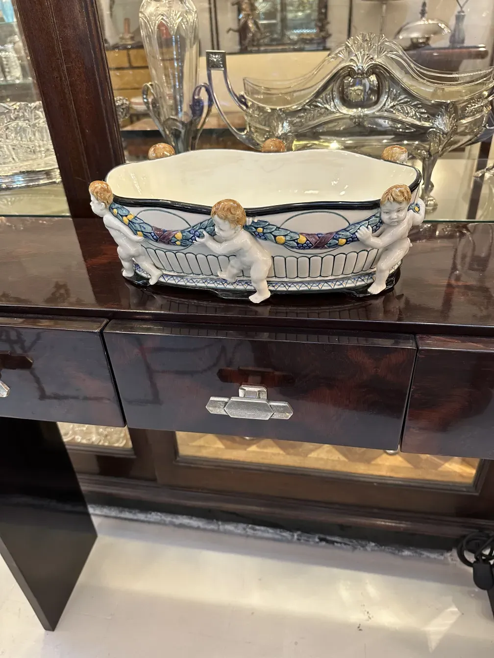 antique ceramic bowl with decorative child figures