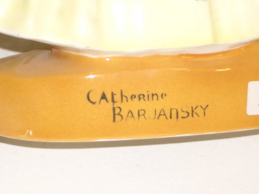 antique ceramic with artisanal details and visible signature