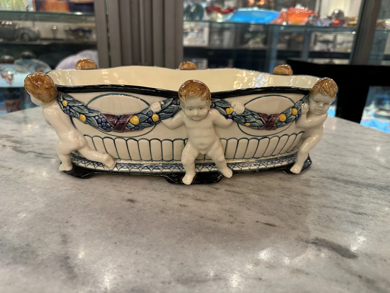 antique ceramic bowl with decorative child figures