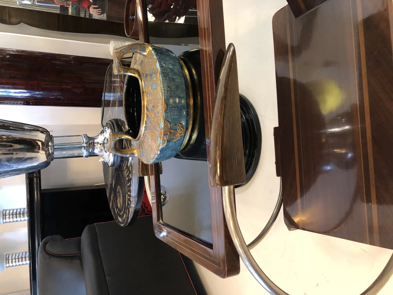 antique ceramic piece with gold and blue details on black base