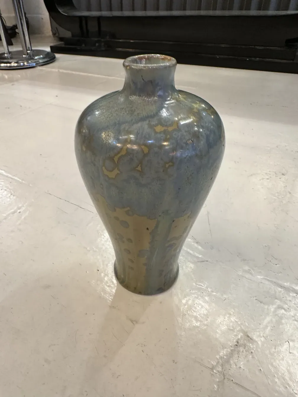 Antique ceramic vase with blue and gold finishes