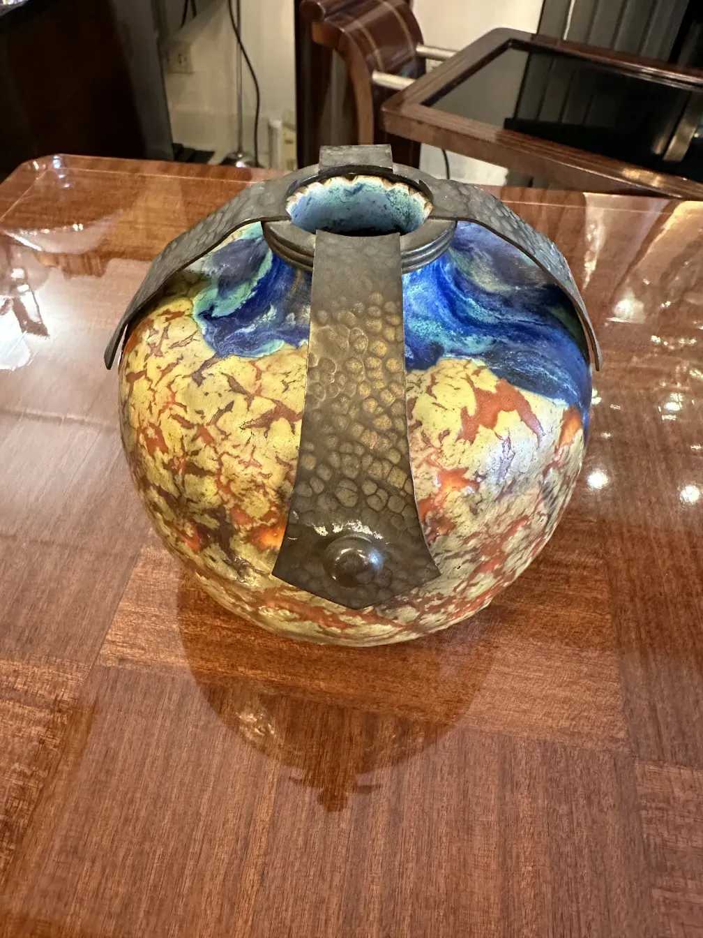 Antique ceramic vase with vibrant colors and unique finishes.
