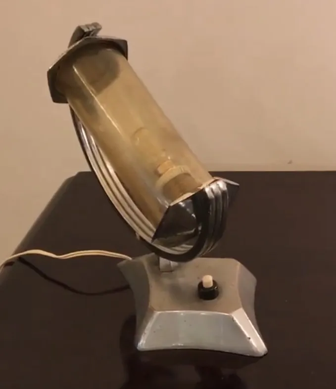 Antique table lamp with a unique design, set in a cozy environment.