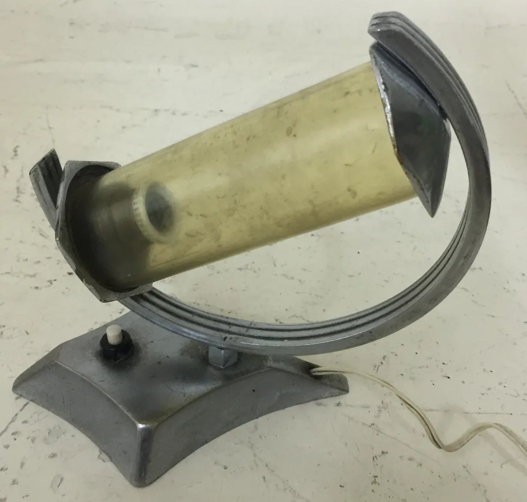 antique table lamp with minimalist tubular design, light background