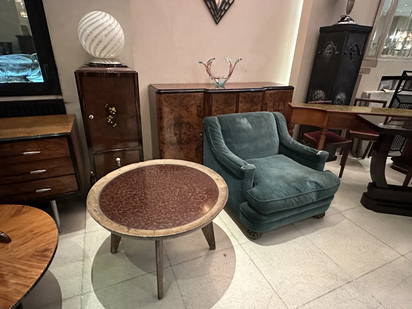 antique table lamp paolo venini on table with blue armchair