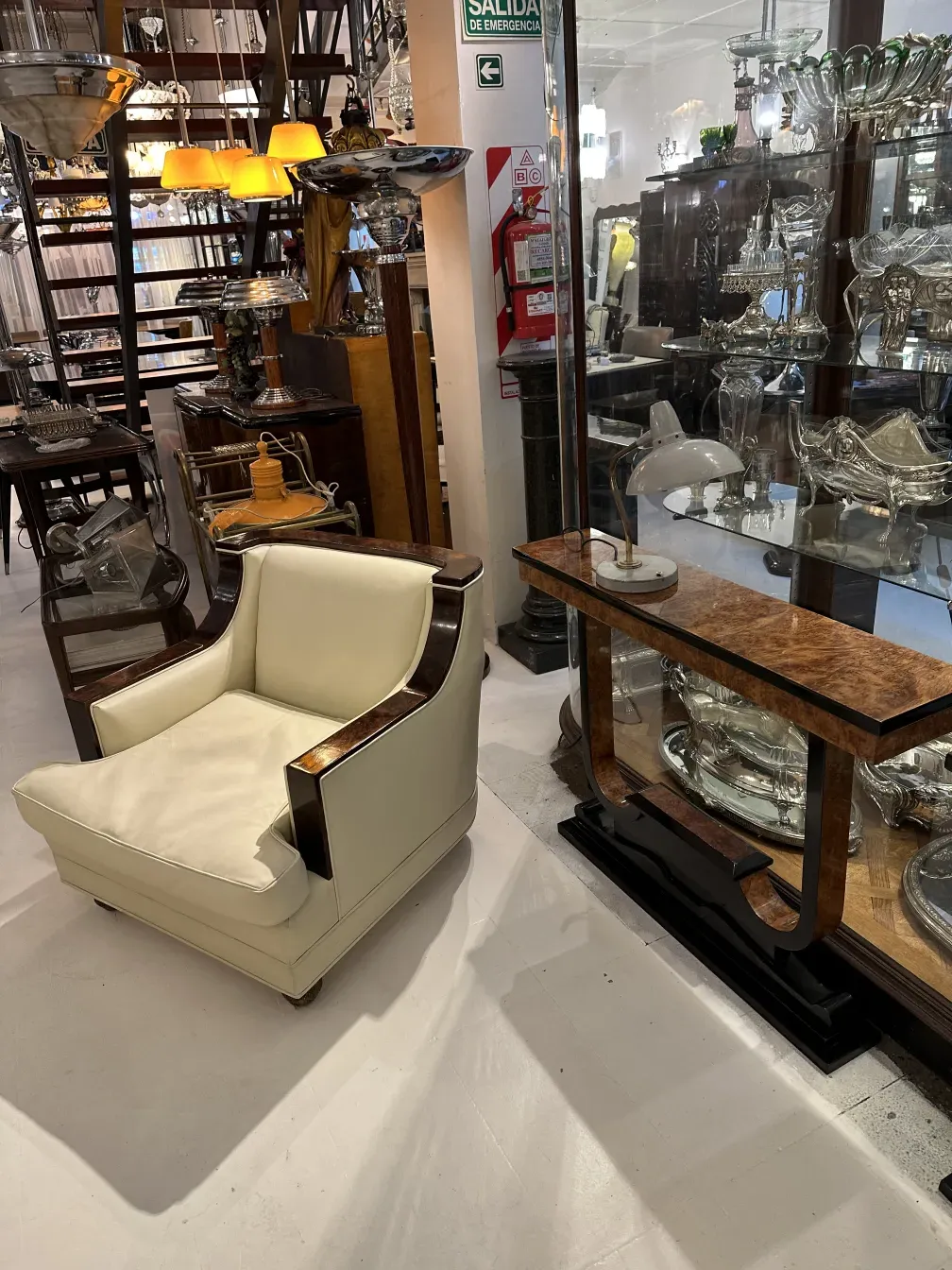 antique table lamp serge mouille displayed in an antiques store