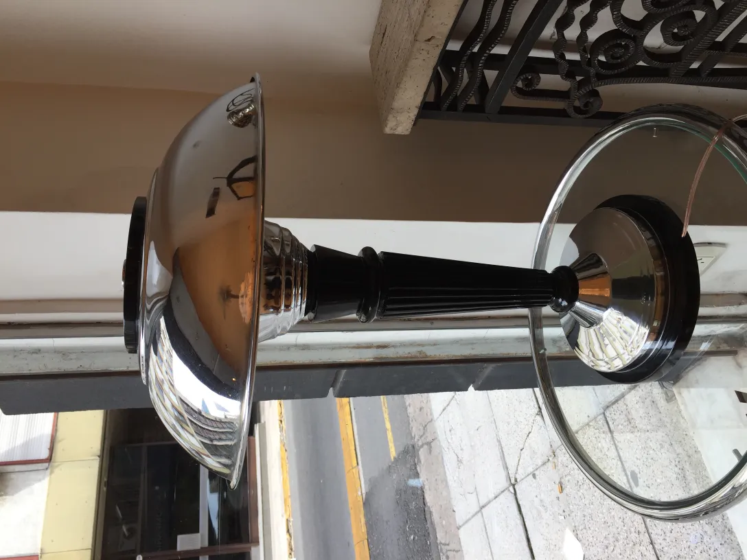 antique shiny table lamp with a modern base and shade, neutral setting