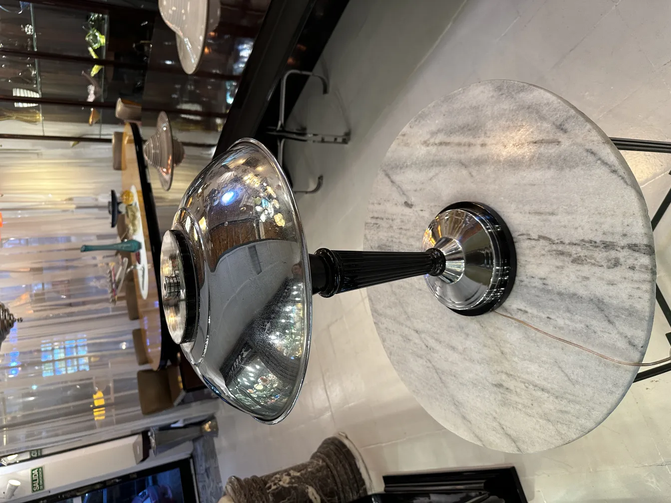 Antique table lamp with shiny surface and elegant design, in a cozy setting