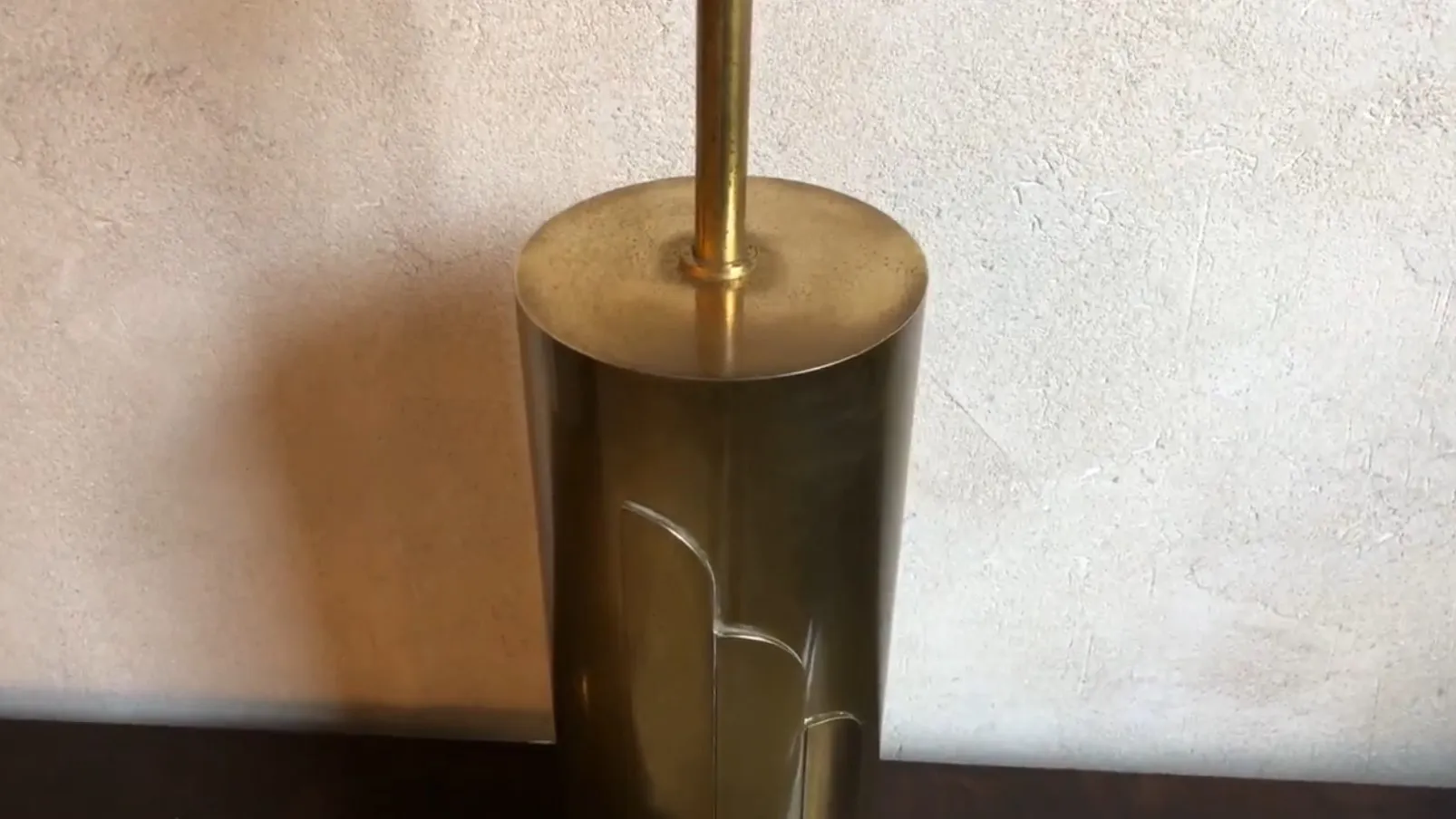 Antique table lamp with round base and elegant design, neutral setting