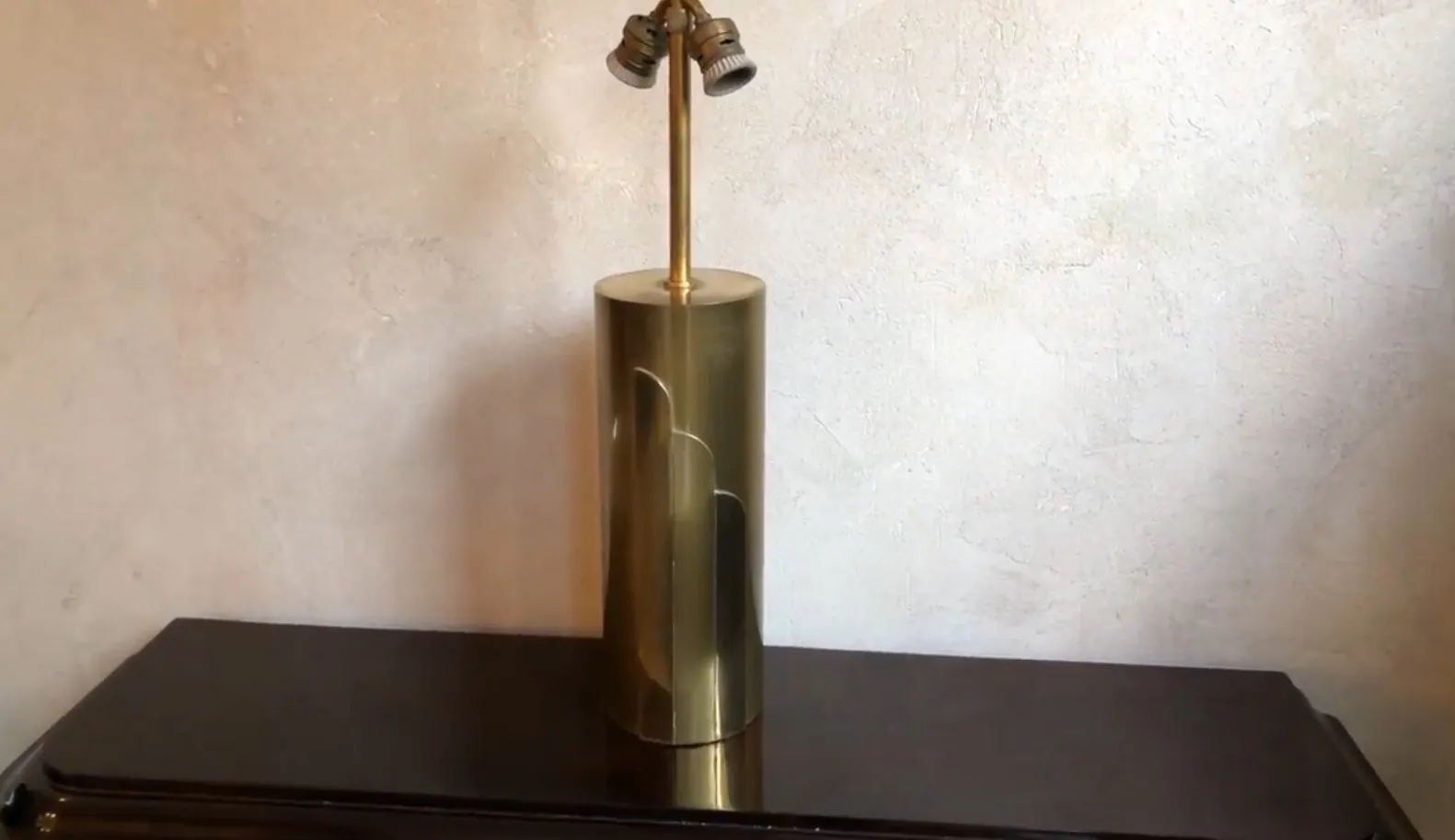 antique table lamp with cylindrical base and two bulbs, warm ambiance