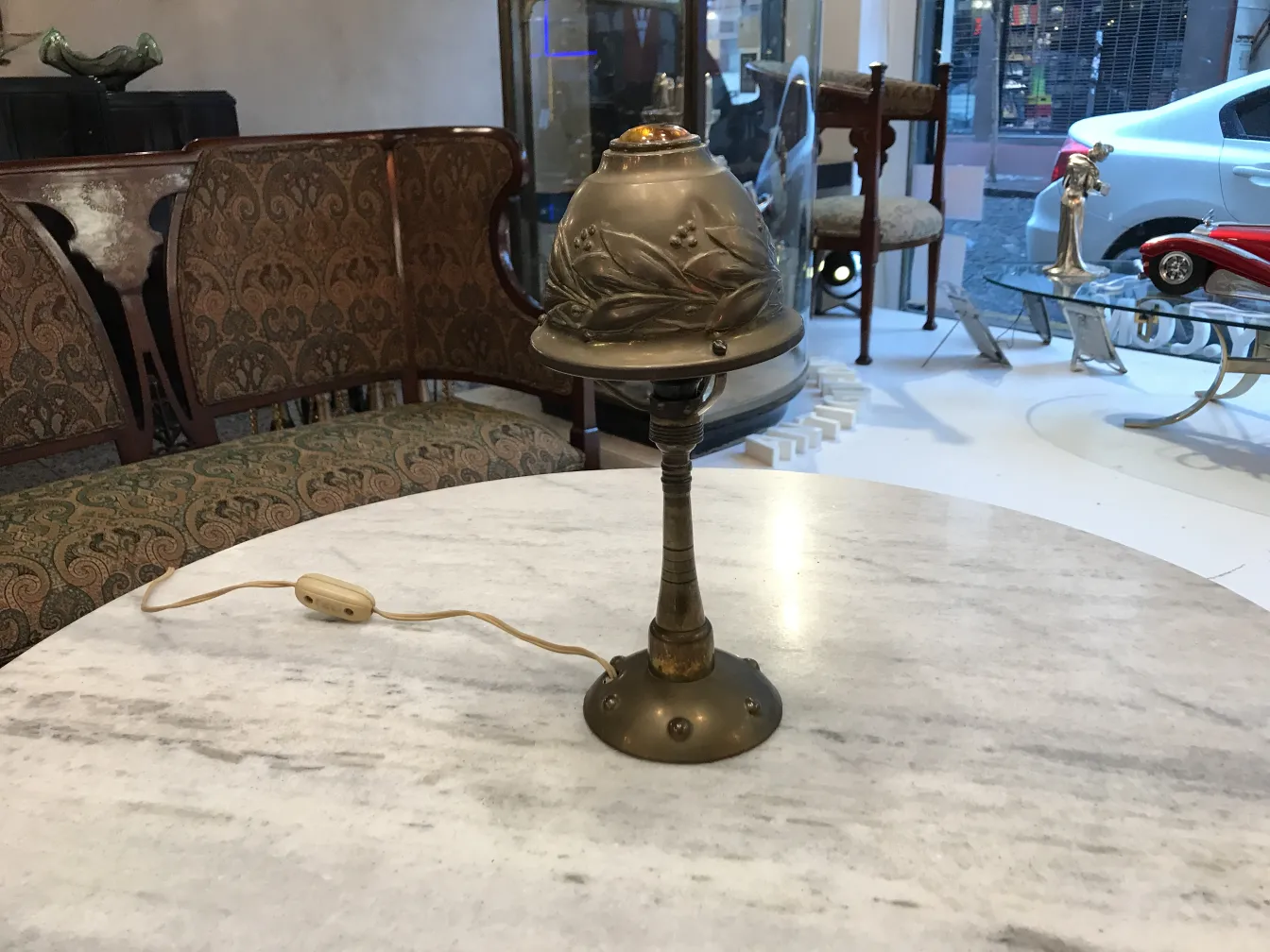 antique table lamp with decorative features and cord