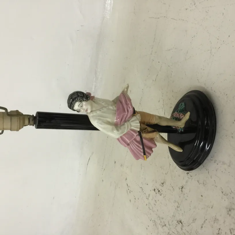 antique table lamp with decorative figure on the base in classic style