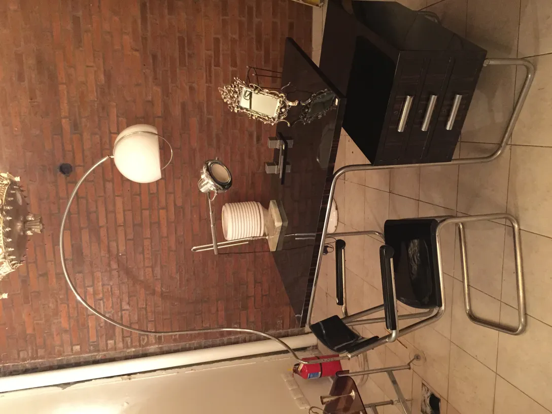 Antique table lamp with soft light, brick background