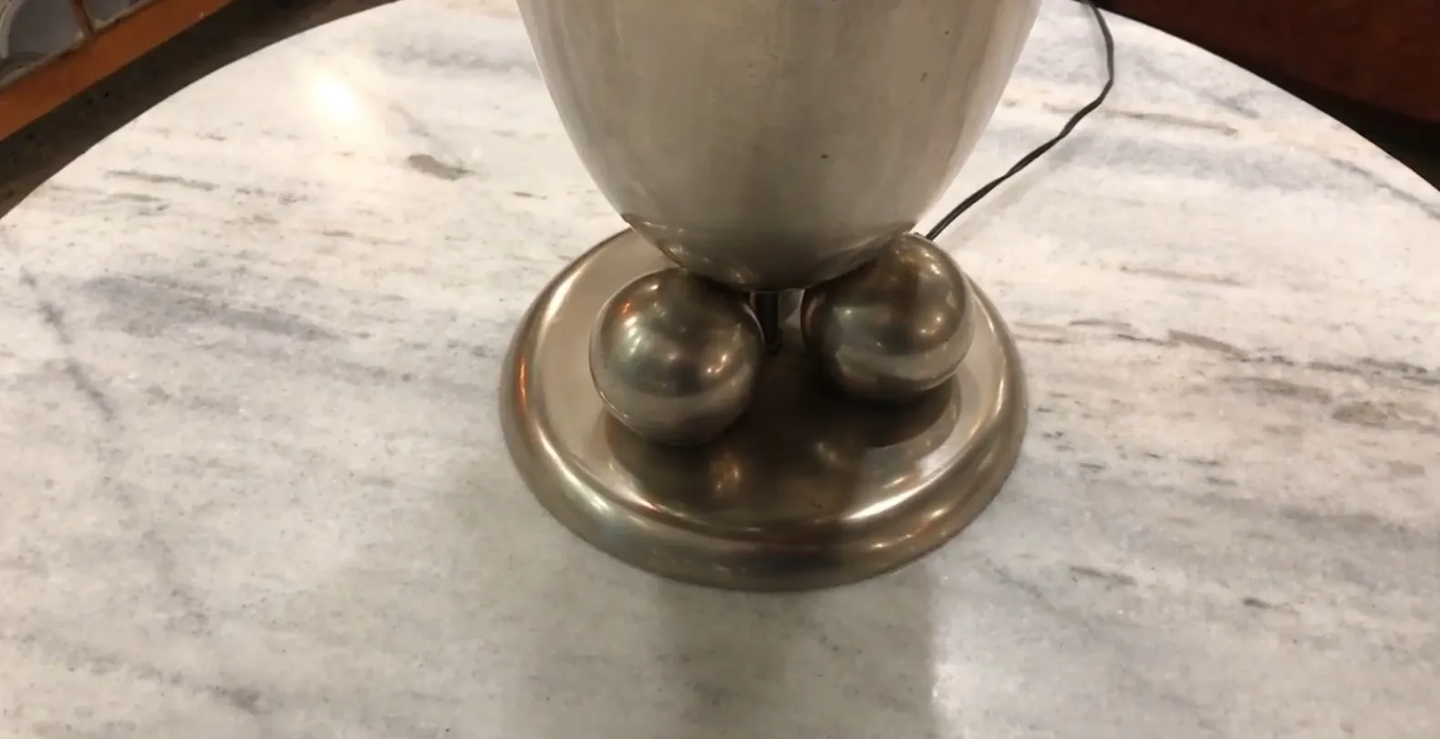 Antique table lamp WMF on marble surface.