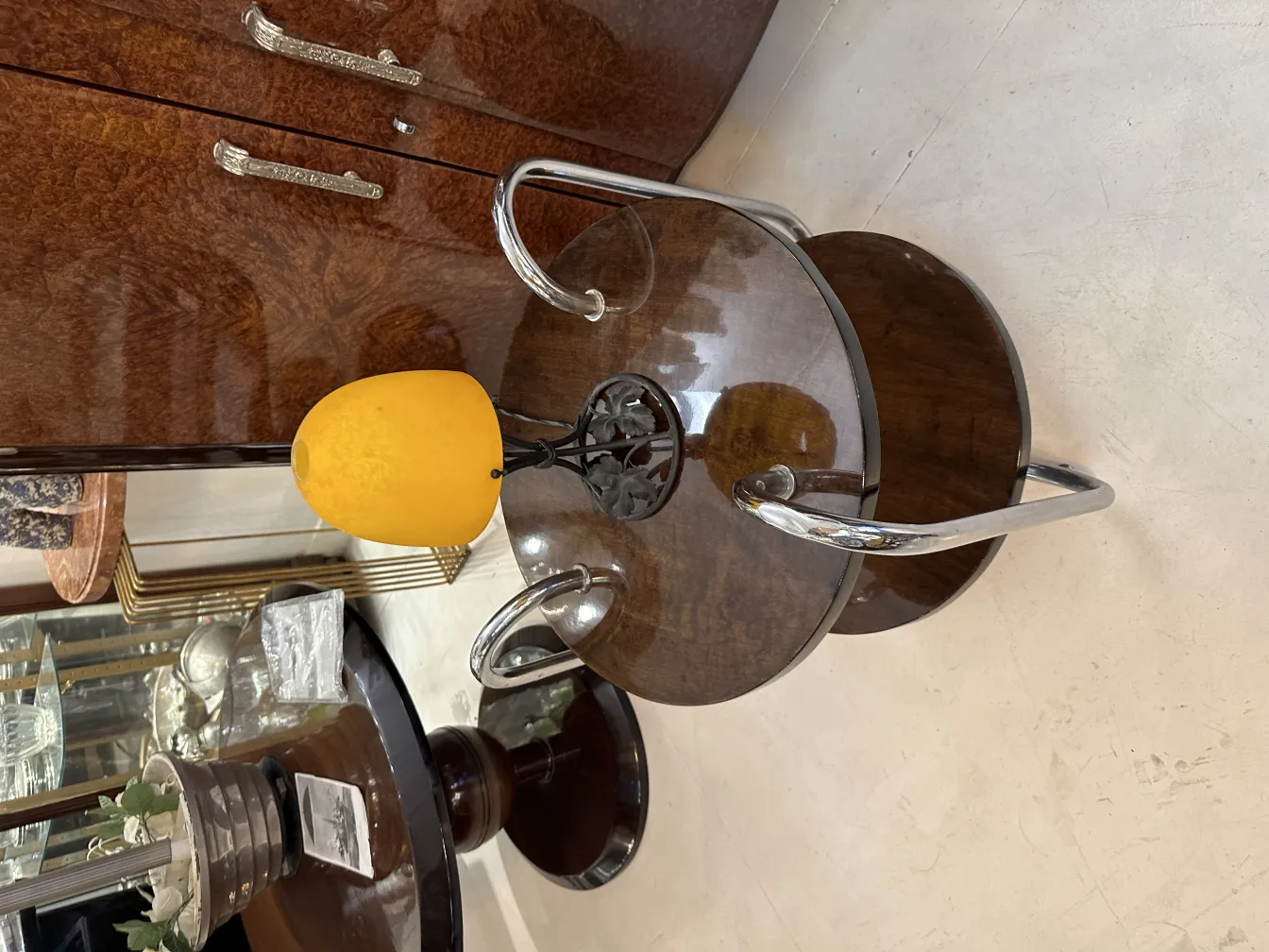 Antique table lamp with yellow light, cozy ambiance.