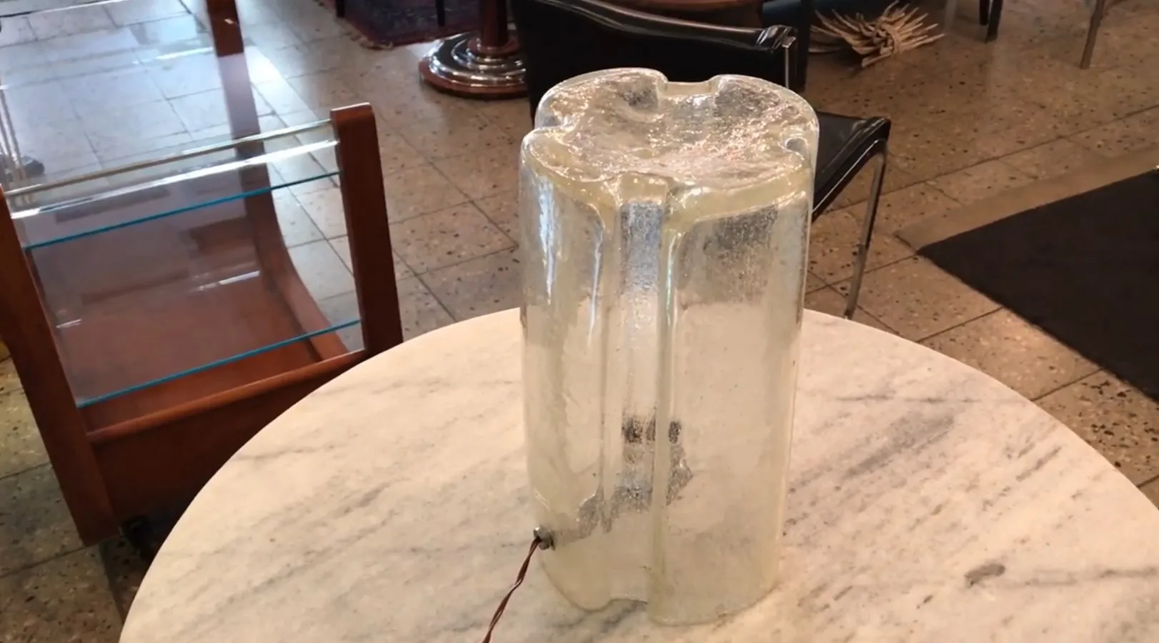 Antique table lamp with a translucent design, enhancing the room's aesthetics