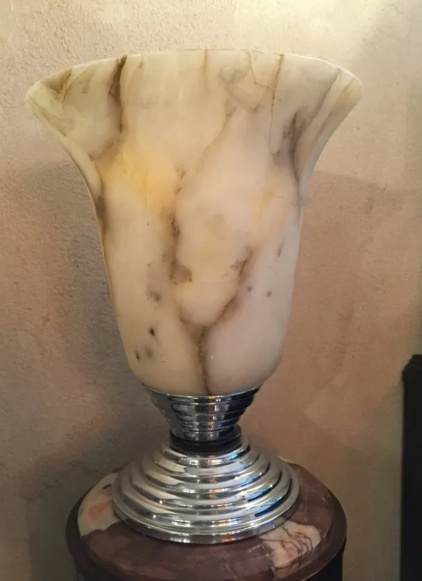 antique table lamp with smooth curves and shiny base