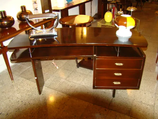 white antique table lamp with details on office desk