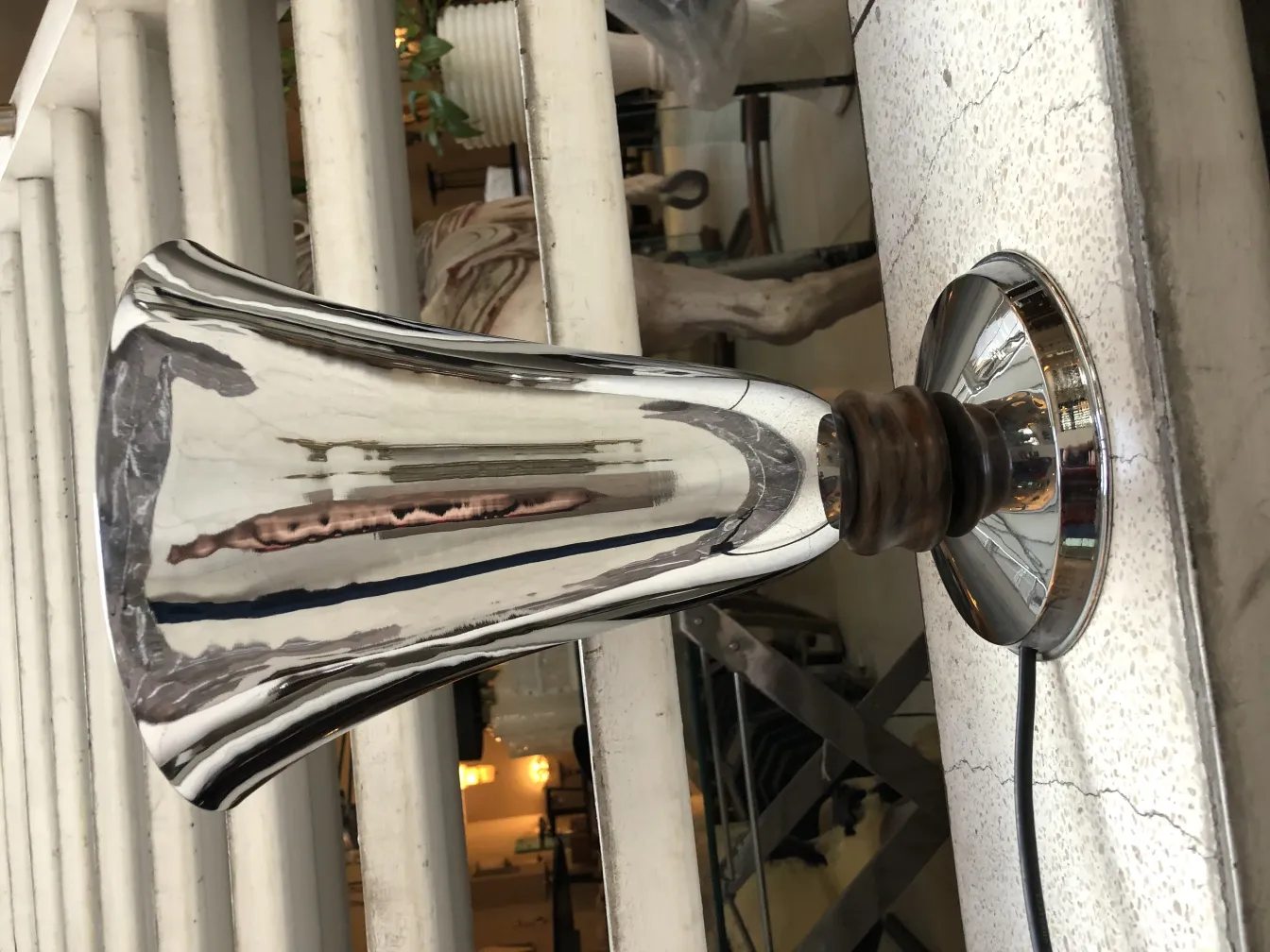 Shiny antique table lamp with elegant design.