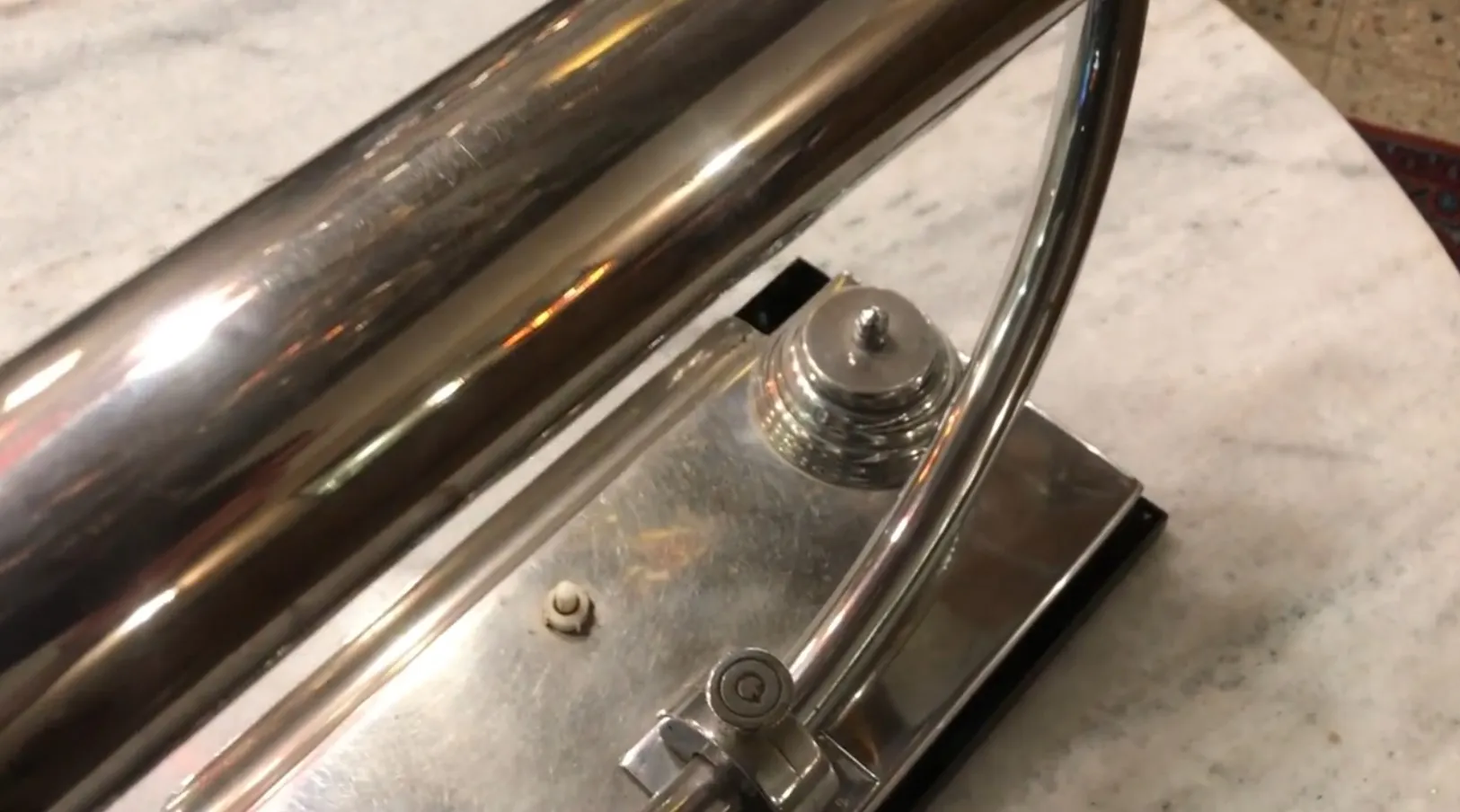 antique shiny table lamp with elegant shape on table