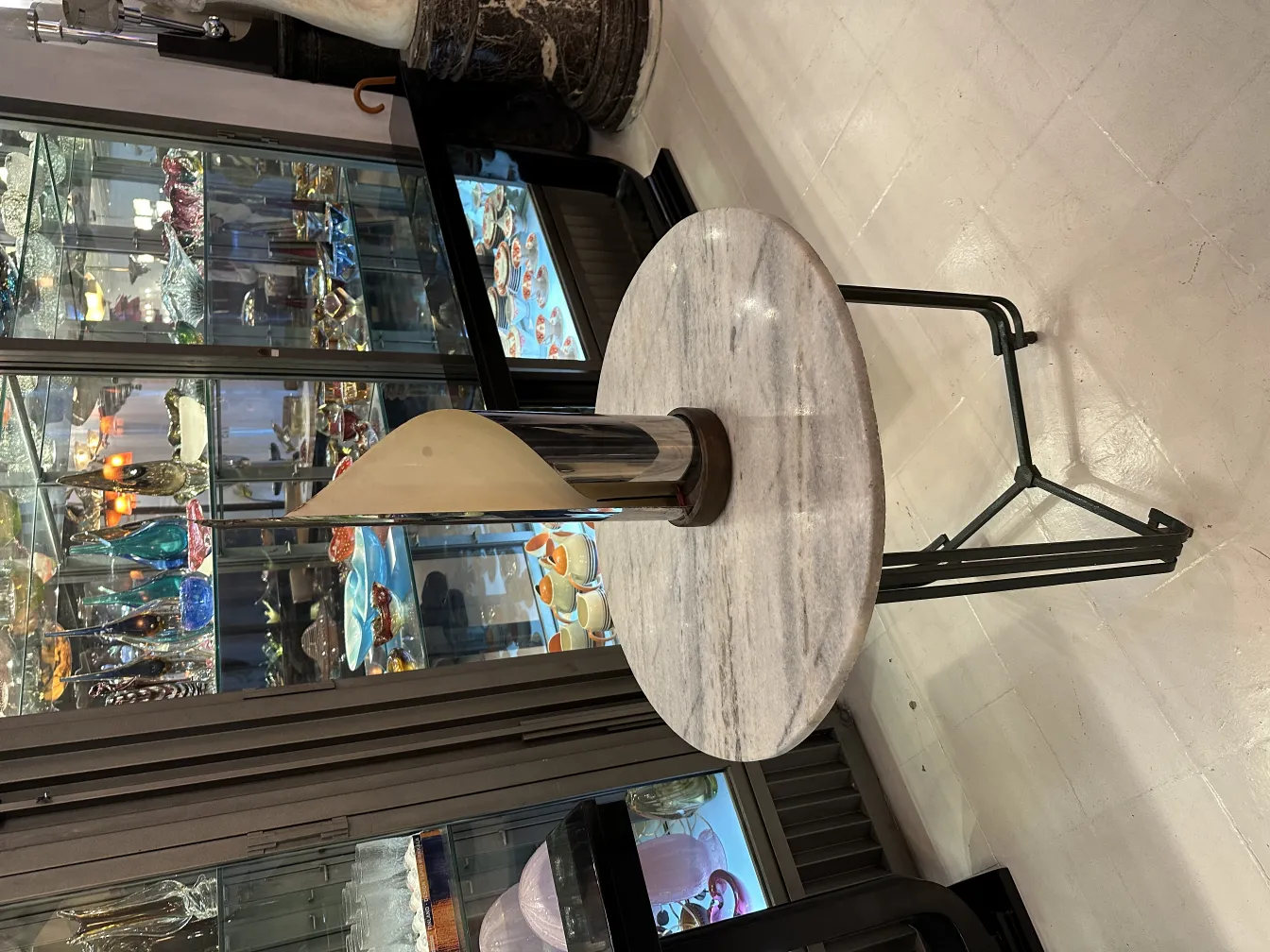 Antique table lamp with distinctive design and shade.