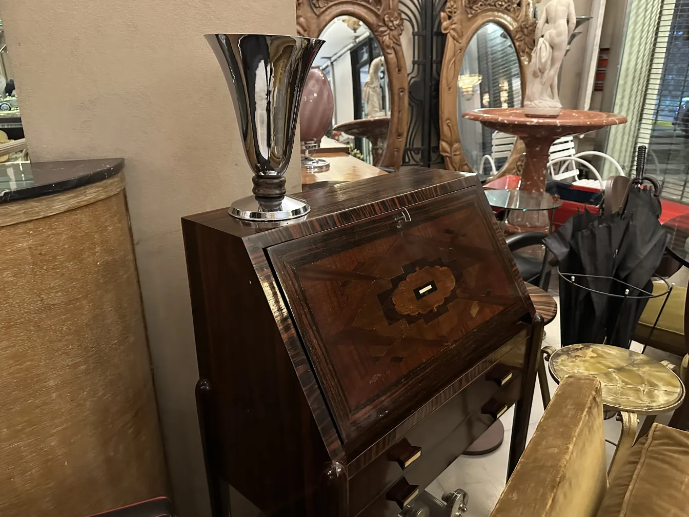 Antique table lamp with shiny metallic details on an elegant desk