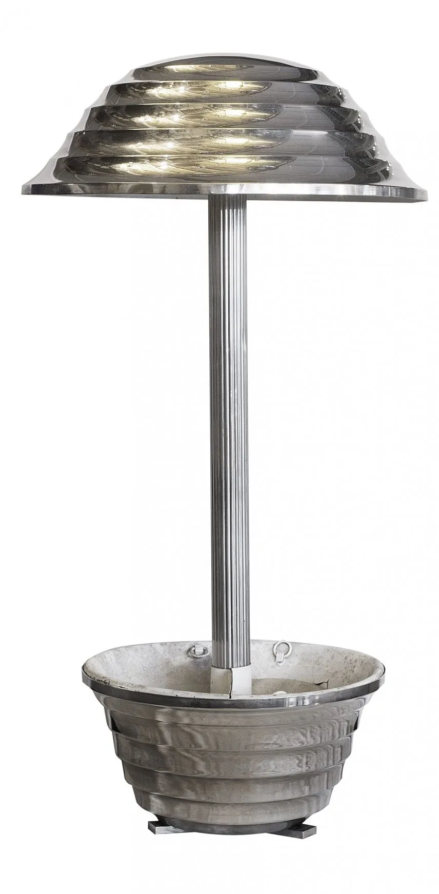 An antique table lamp with an attractive design, in a cozy setting.