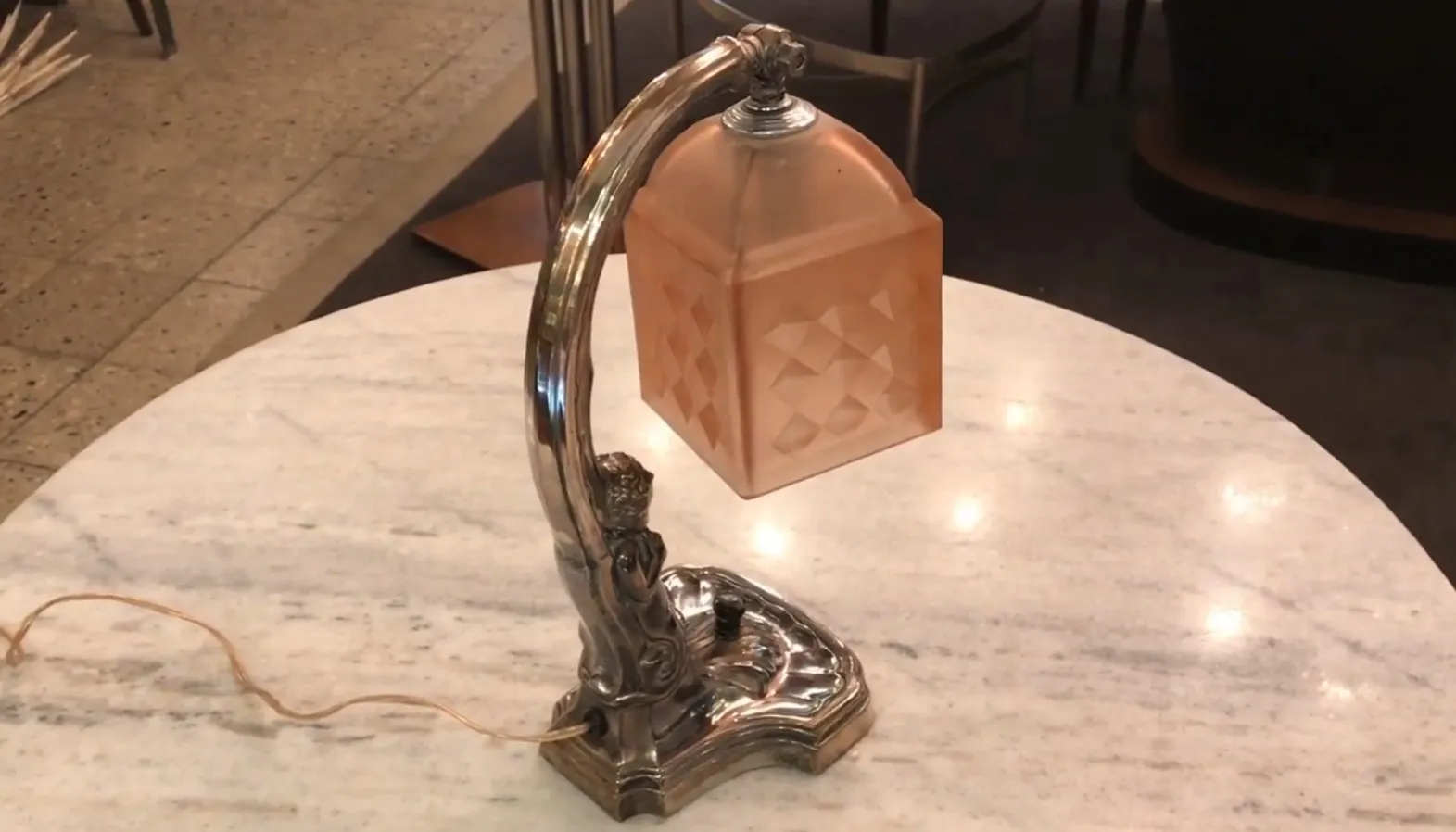 antique table lamp with decorative base, soft light