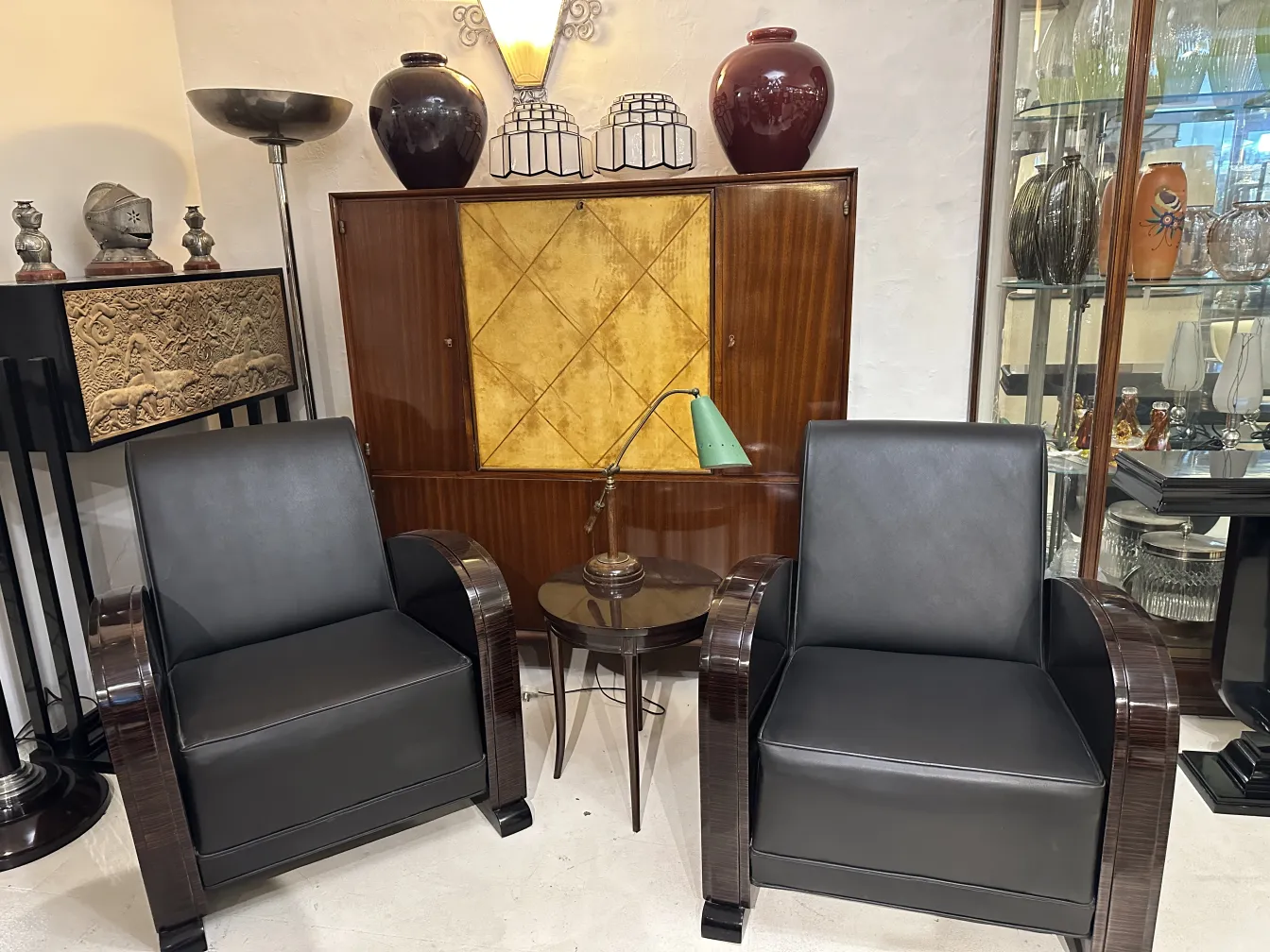 antique green table lamp in room with armchairs